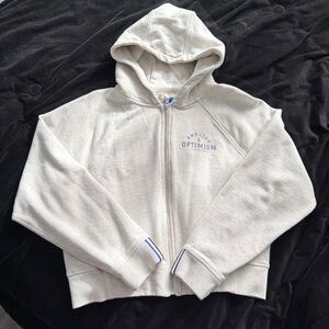 Kit and Ace Cream Zip-Up Hoodie with Optimism Print